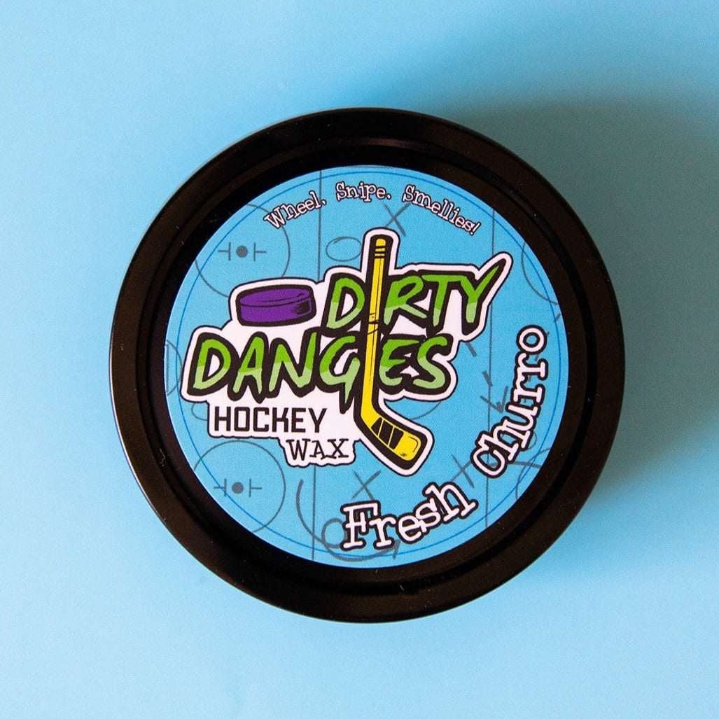 Hockey wax tin with black rim and blue Dirty Dangers Hockey Wax label