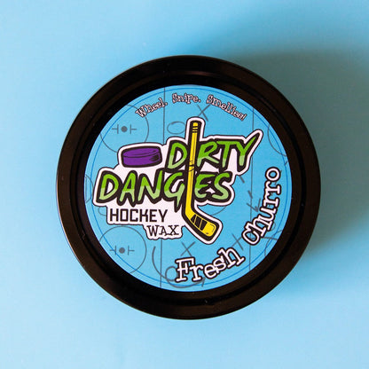 Hockey wax tin with black rim and blue Dirty Dangers Hockey Wax label