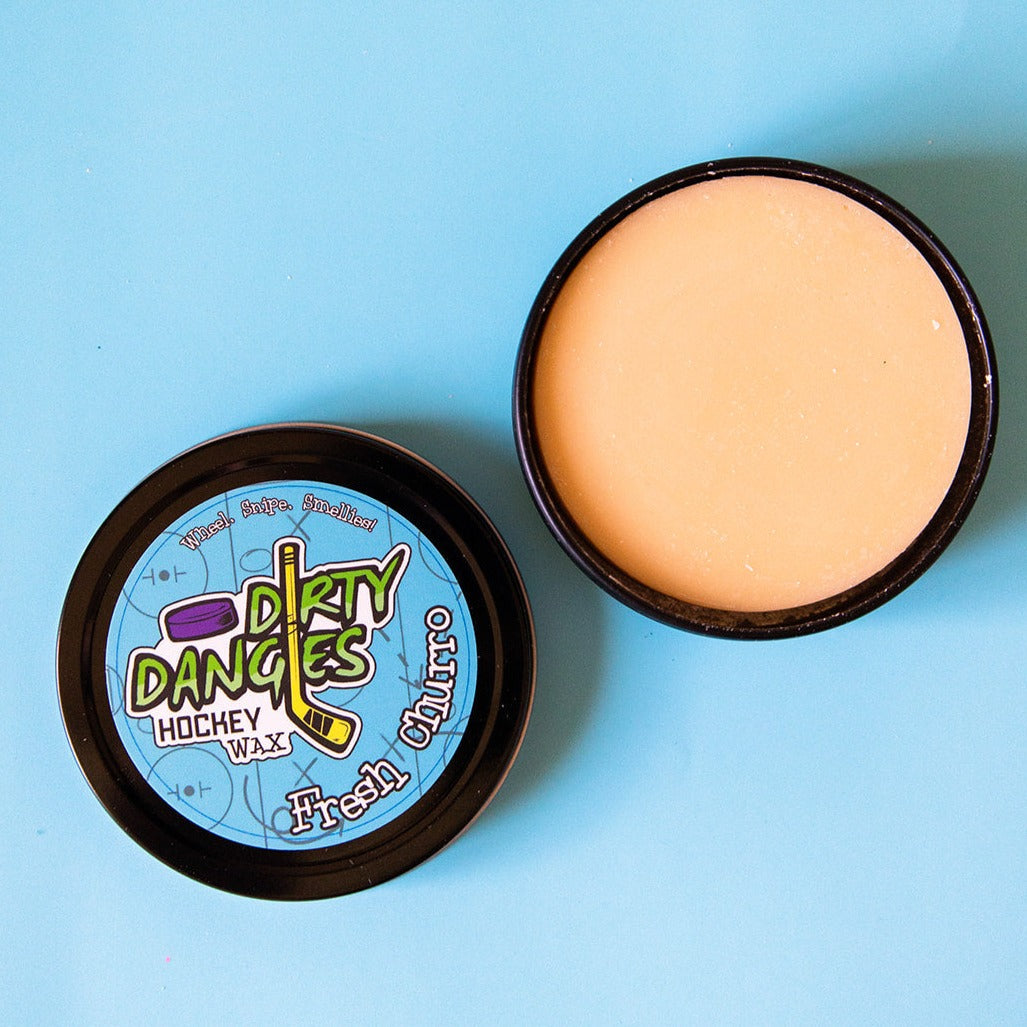 Hockey wax tins with blue Dirty Dangers labels, showing pale wax under open lids