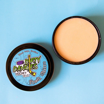 Hockey wax tins with blue Dirty Dangers labels, showing pale wax under open lids