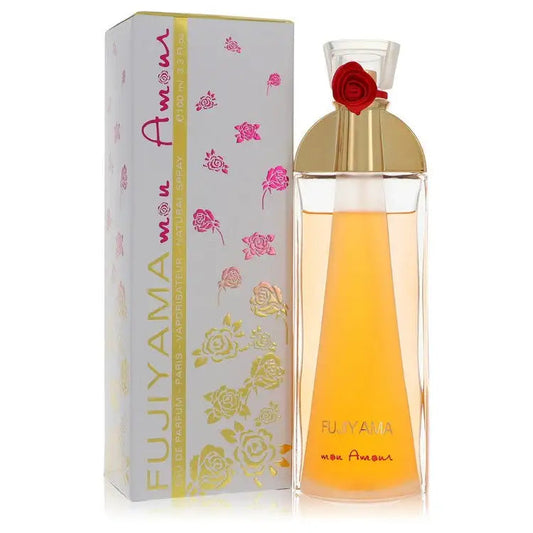 Fujiyama Mon Amour women’s perfume bottle with amber liquid, gold top, red rose beside box