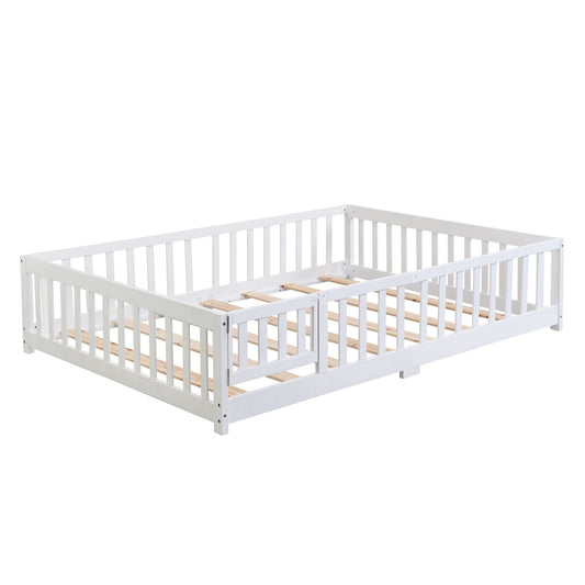 White toddler floor bed frame with vertical safety rails and light wood support slats