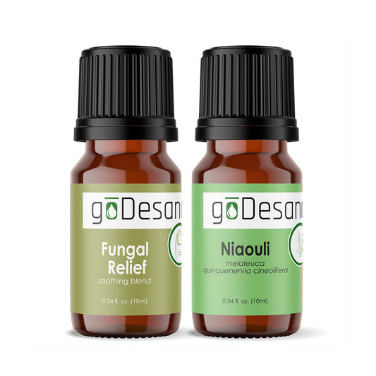 Amber essential oil bottles with black caps, Fungal Relief and Niaouli labels