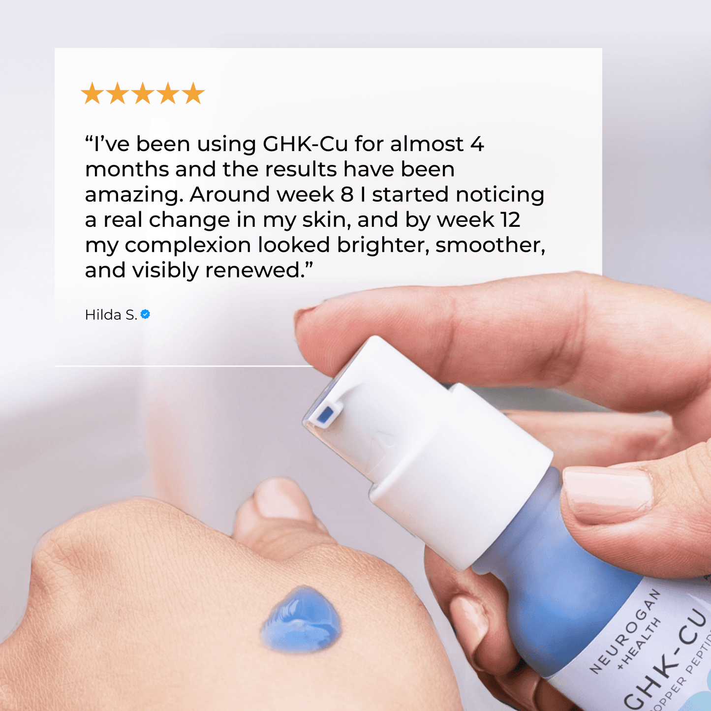 GHK-Cu face serum bottle in hand with blue gel on skin for topical application