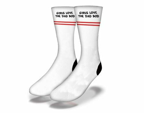 White crew socks with red stripe and text "GIRLS LOVE THE DAD BOD", black toe/heel