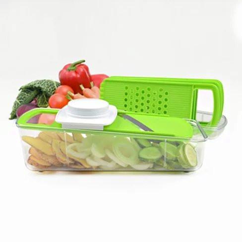 4-in-1 veggie grinder with green slicer/grater and clear container, white lid