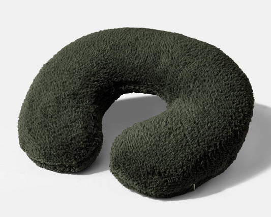 Weighted neck pillow with dark green plush cover and U-shaped design