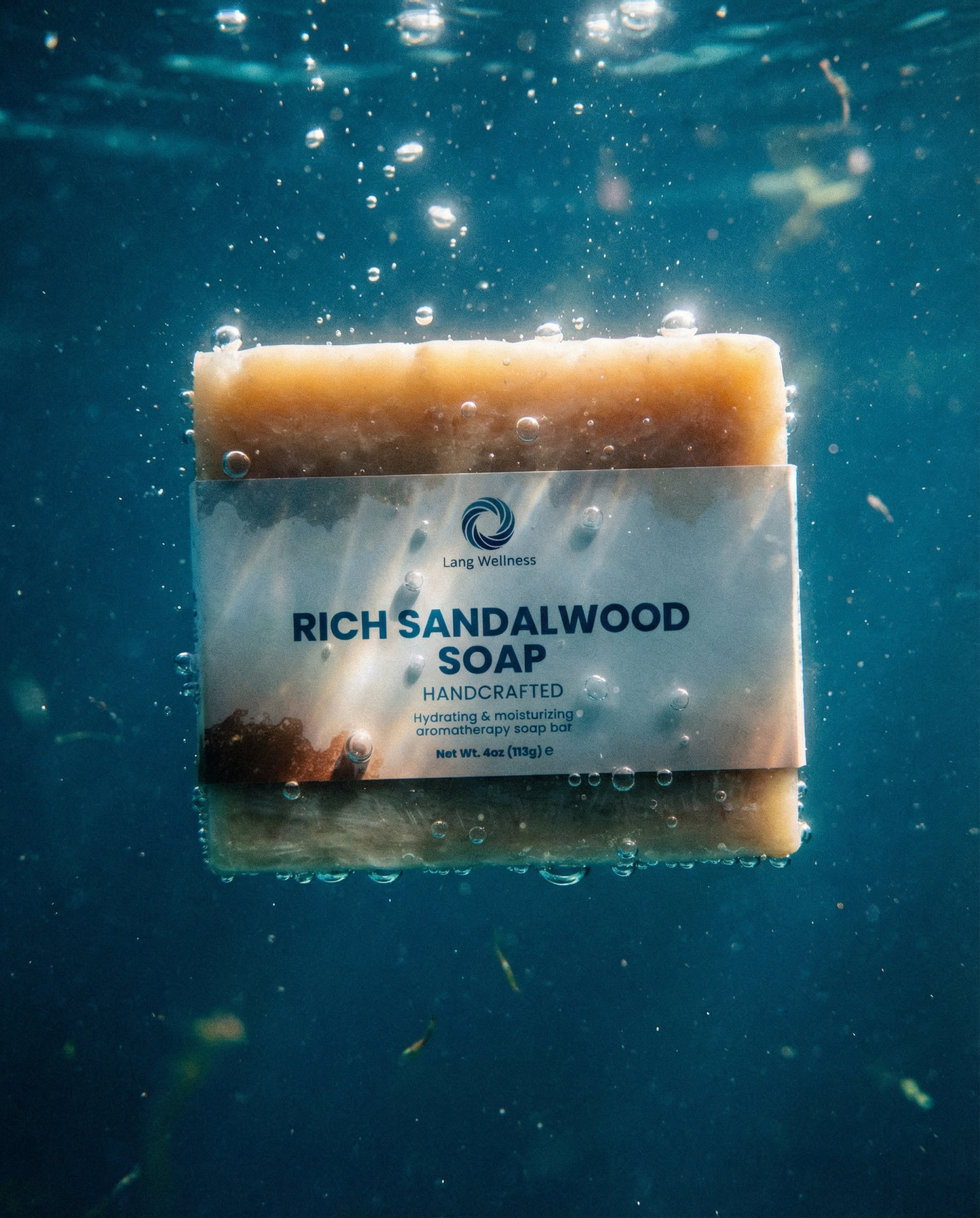 Rich sandalwood soap bar in water, beige with front label visible