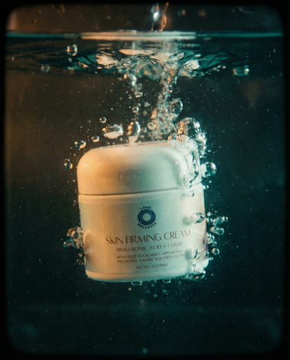 Skin firming cream jar with white lid, partially shown under water droplets