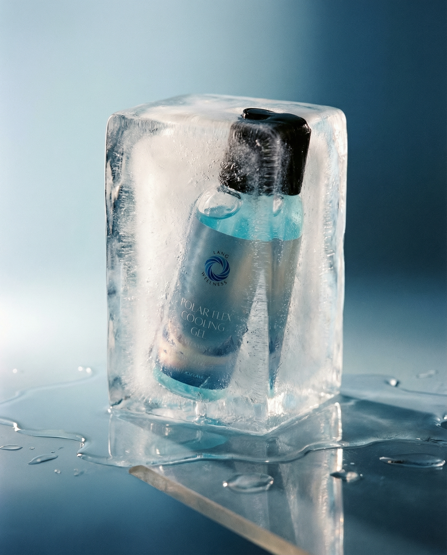 Cooling gel bottle standing in an ice cube with blue tinted liquid