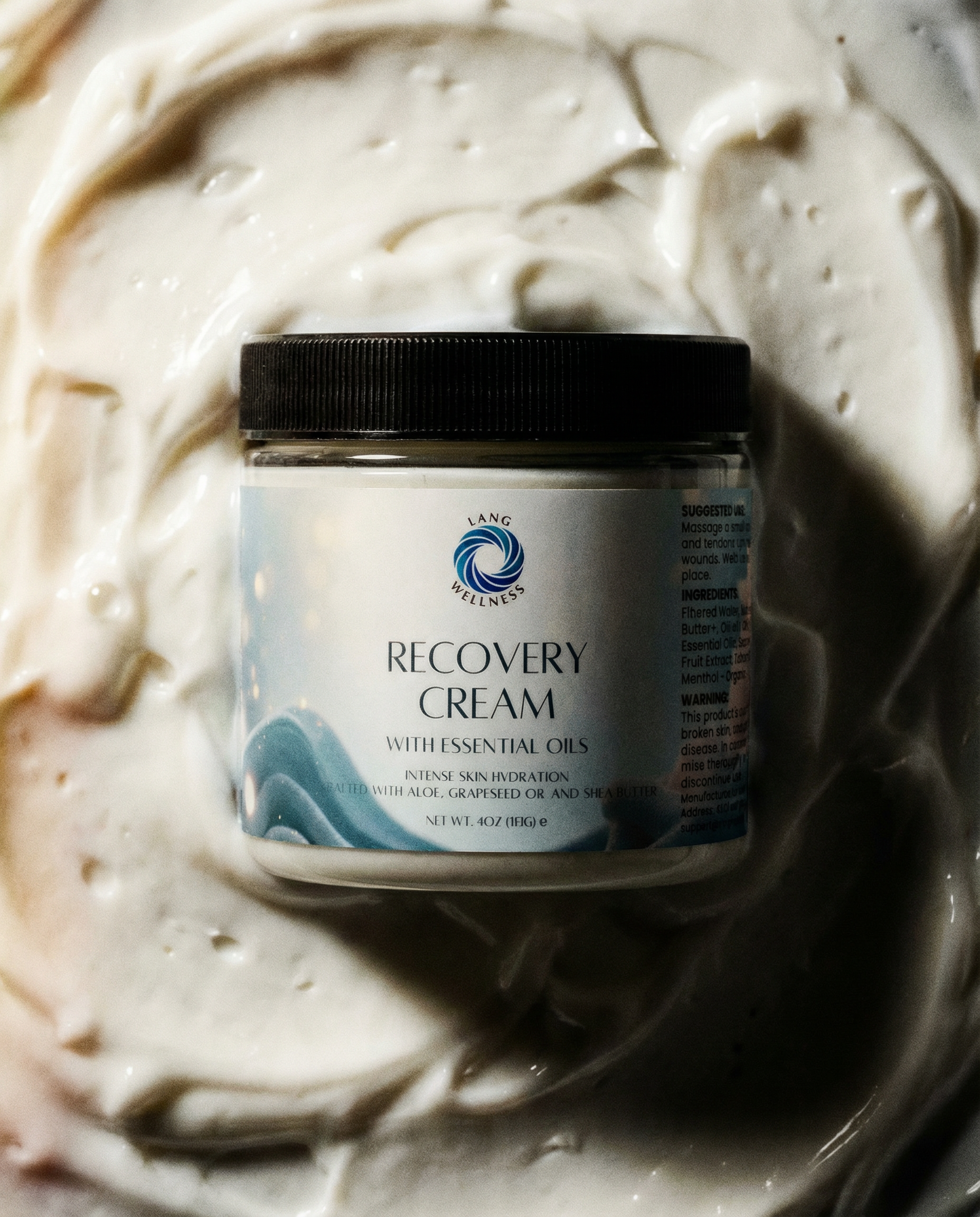 Recovery cream jar with black lid, label facing forward; white cream swirls visible