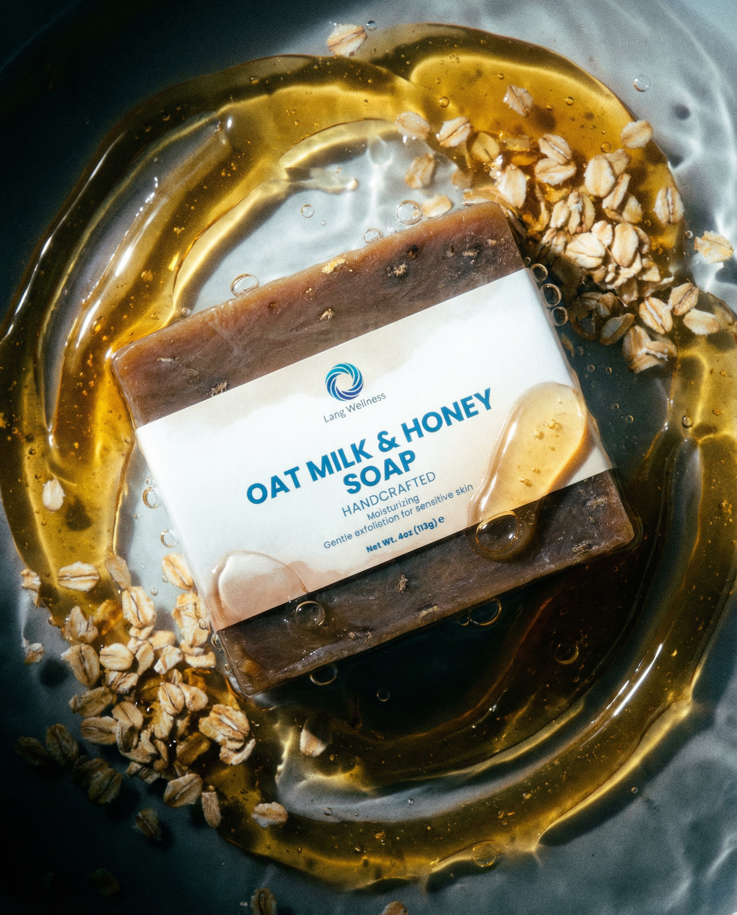 Oat milk & honey soap bar, dark brown with oatmeal specks and label wrapper