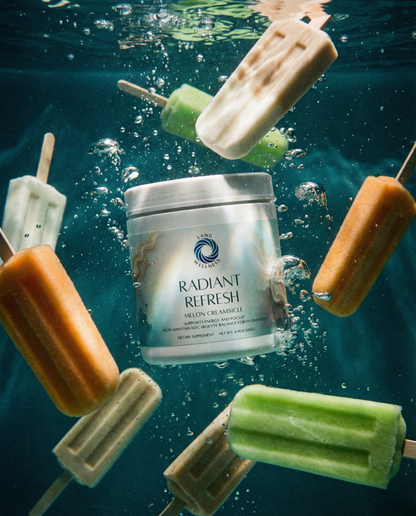 Skin cream jar in water with floating melon pops and splashing droplets