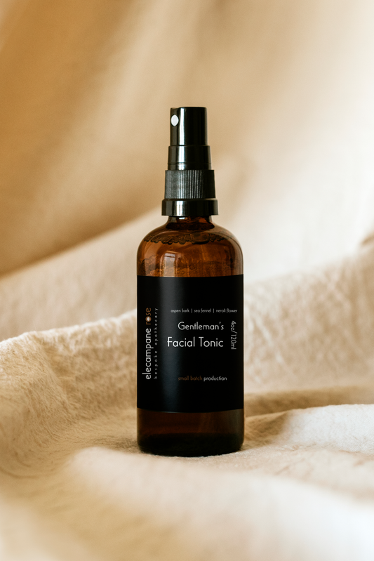 Gentlemen's facial tonic spray bottle, amber glass with black pump