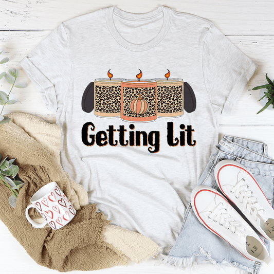 Heather gray crew-neck T-shirt featuring "Getting Lit" candle graphic with orange flames
