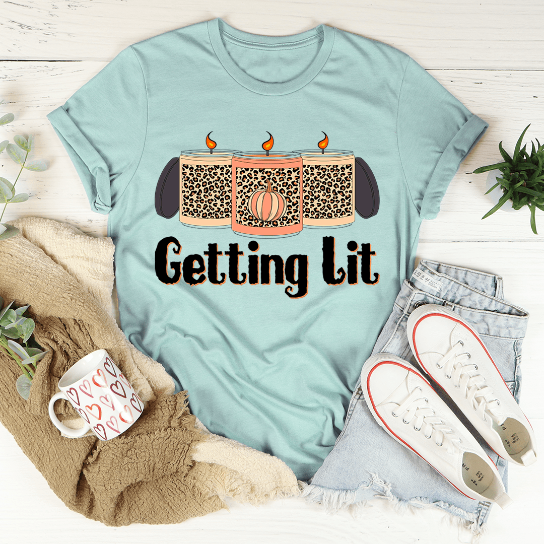 Teal front graphic T-shirt with candle and 'Getting lit' text