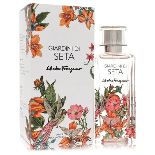 Floral Eau de Parfum bottle and matching box, clear glass with silver cap