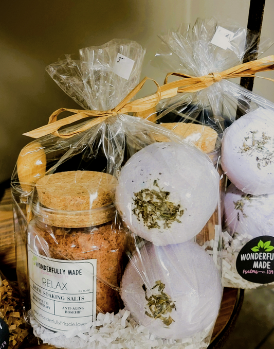 Relax bath gift bundle with raffia ribbon, jars of soaking salts and white bath bombs
