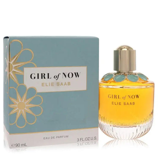 Women's eau de parfum bottle with amber liquid and gold cap, with blue box