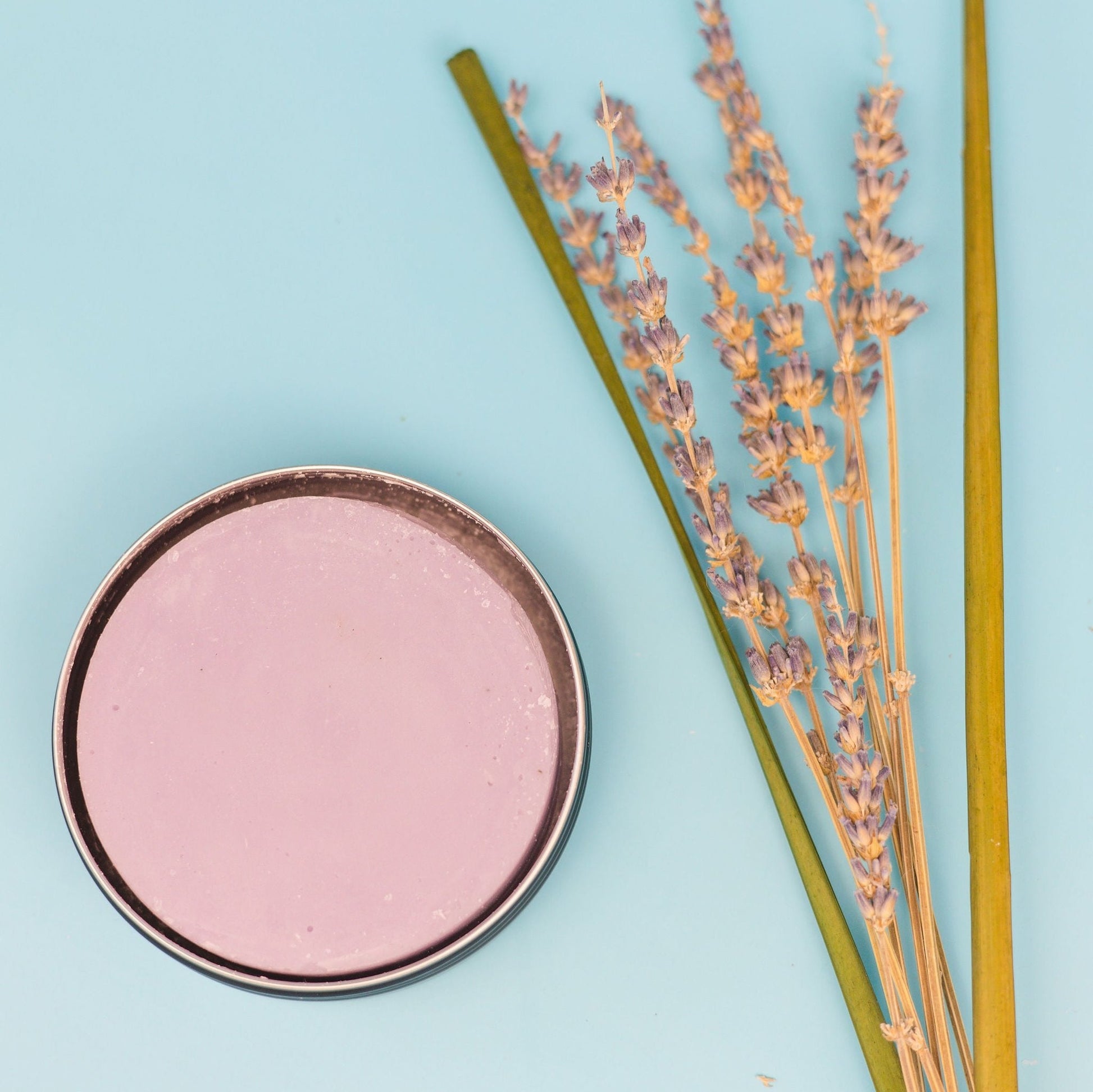 Certified Beaut hockey stick wax tin with pink wax surface