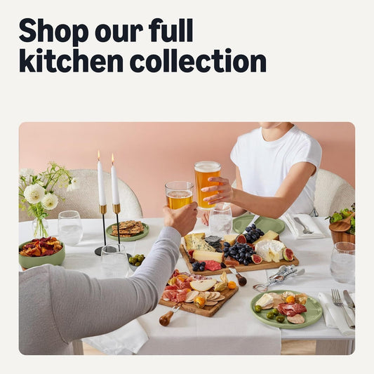 Olive appetizer plates set on table with small snacks and serving dishes