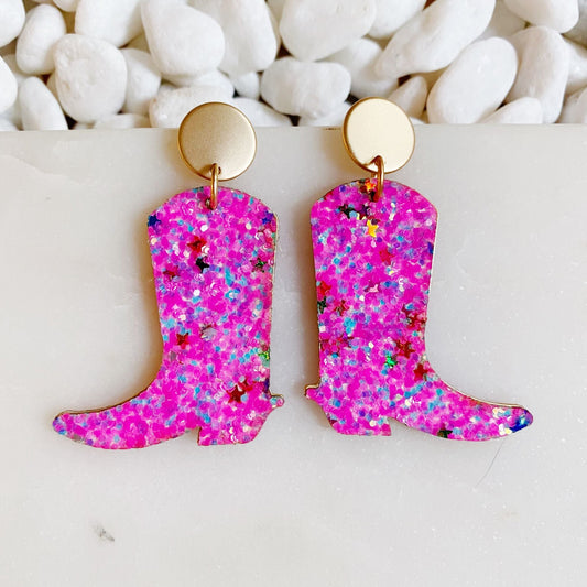 Pink glitter cowboy boot earrings with gold hoop top and dangling boot charms.