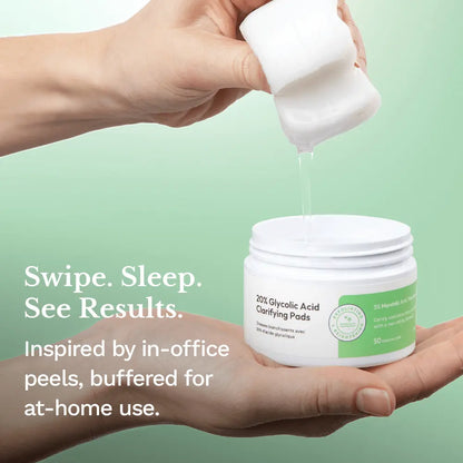 Hands holding a jar of clarifying peel pads as white liquid pours