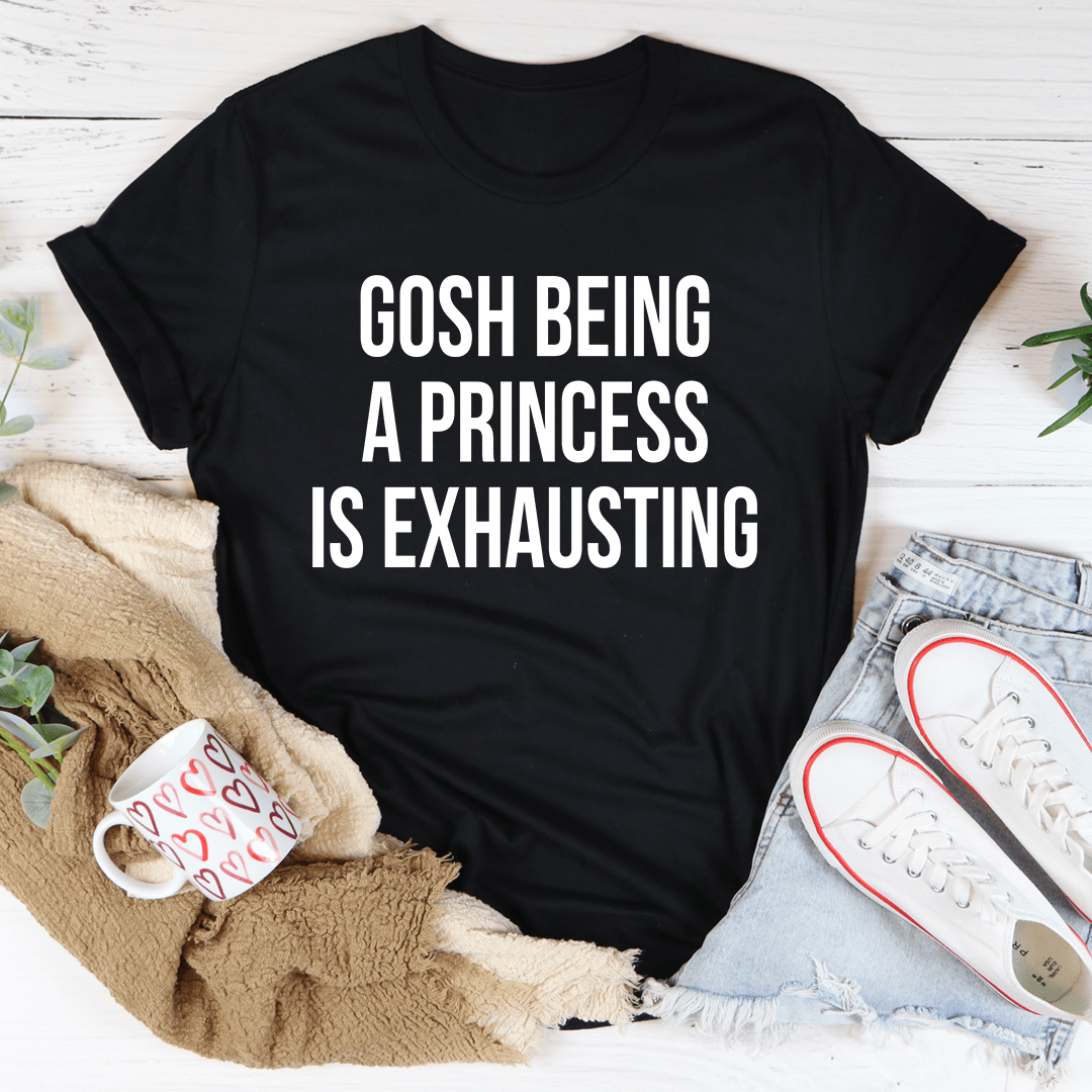 Black short-sleeve t-shirt with 'Gosh Being A Princess Is Exhausting' text graphic