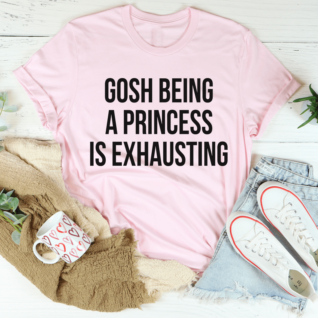 Light pink T-shirt with white slogan: 'Gosh Being A Princess Is Exhausting'