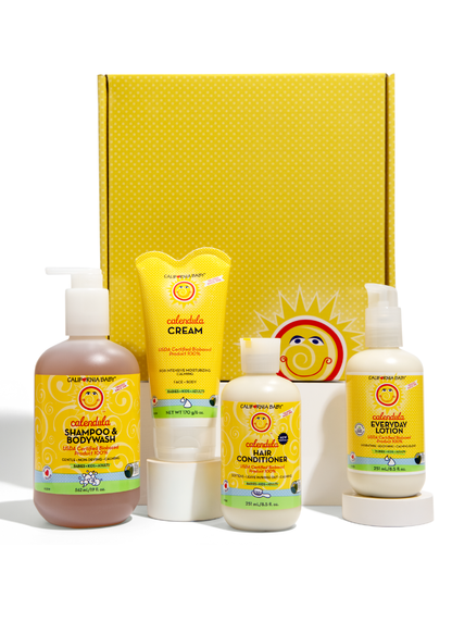 Calendula™ gift set with assorted bottles and cream tubes in yellow display box
