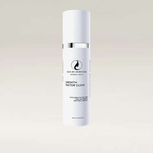 Facial serum bottle with silver cap and white label
