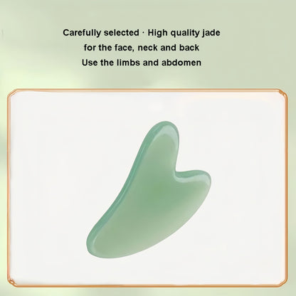 Green jade gua sha face scraper with curved scraping edge and smooth finish