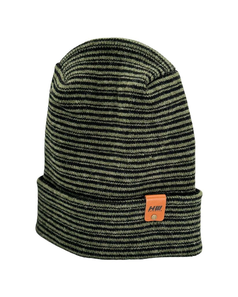 Ribbed knit beanie with green-and-black stripes and fold-over cuff, small patch