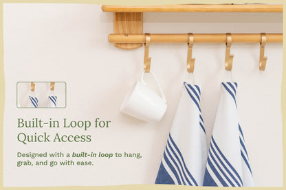 Kitchen towels with navy-and-white stripes hanging on a rod, looped top visible.