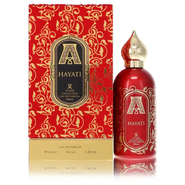 Unisex eau de parfum bottle with red label and gold spray cap, beside matching box