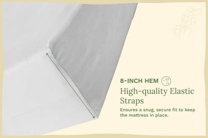 Light gray fitted crib sheet with 8-inch hem and elastic edge straps