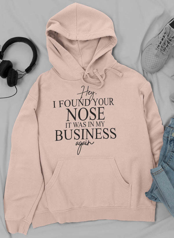 Light pink graphic hoodie with 'I FOUND YOUR NOSE' text, hood and front pouch pocket