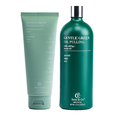 Gentle Green™ toothpaste tube and oil pulling bottle, both mint green