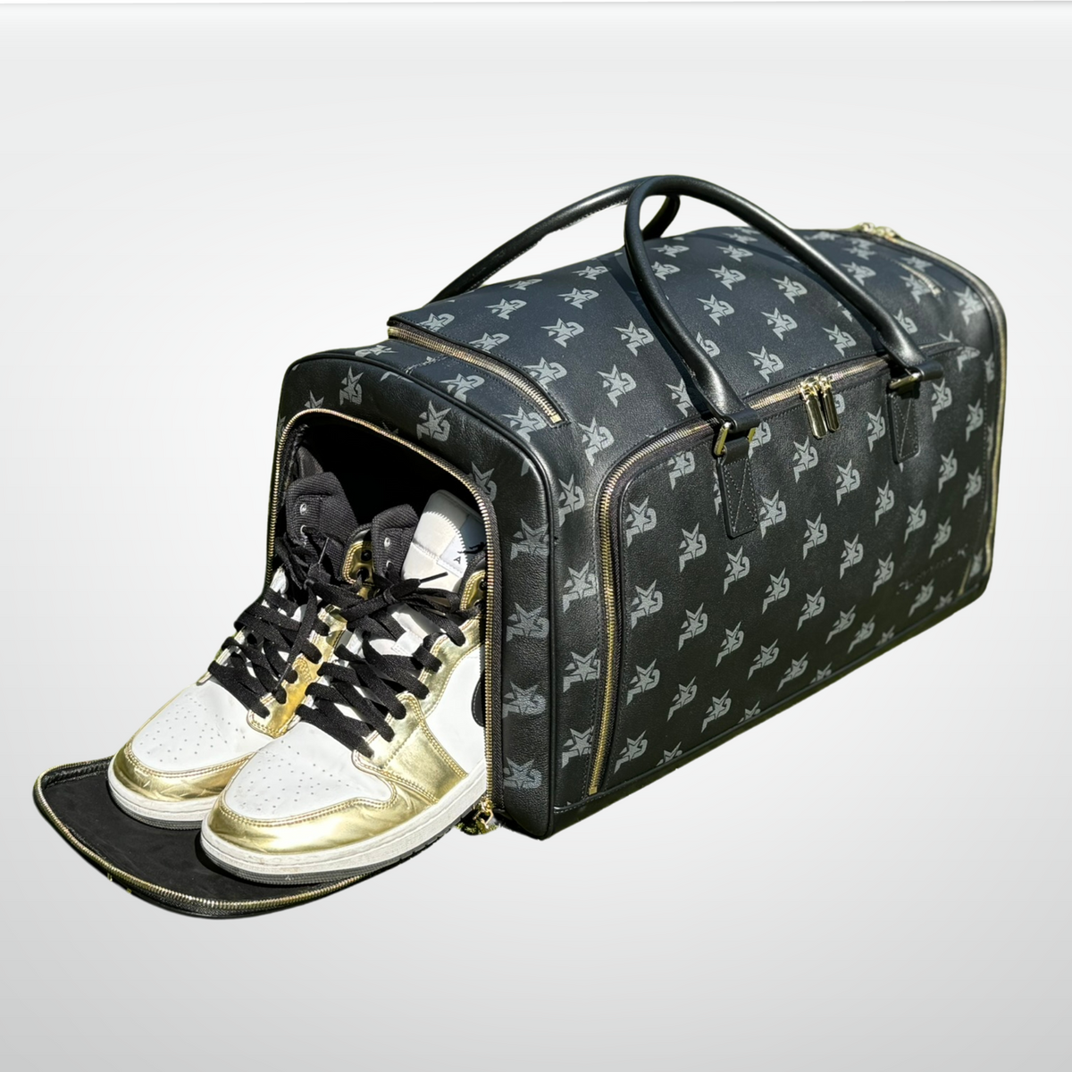 Black leather monogram duffel bag with open top and sneakers inside