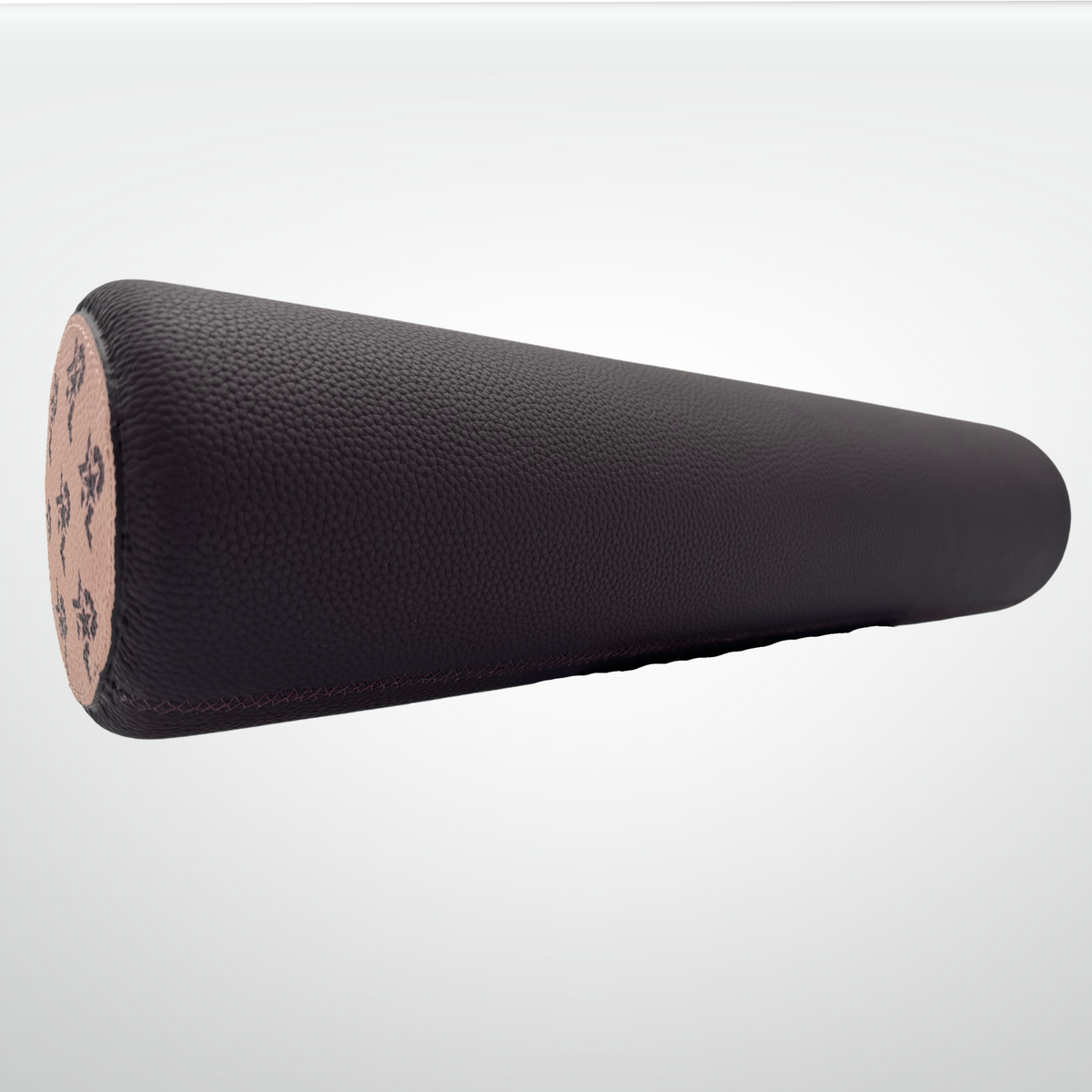 Leather-wrapped cork massage roller, dark brown textured cylinder with end stamp