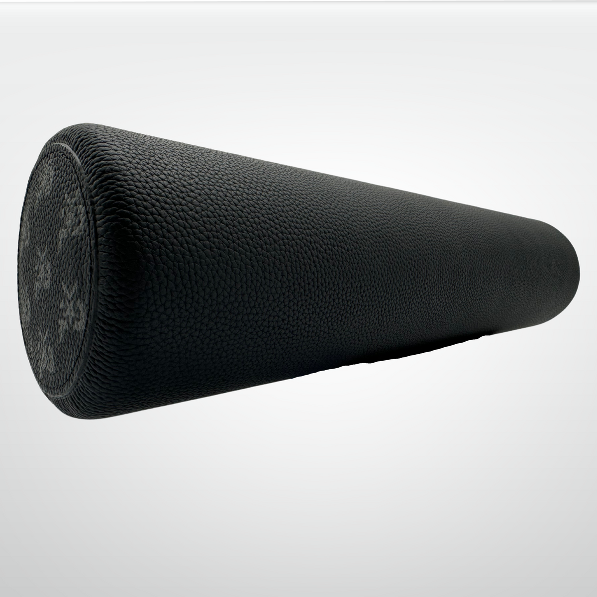 Leather-wrapped cork massage roller, dark charcoal textured cylinder