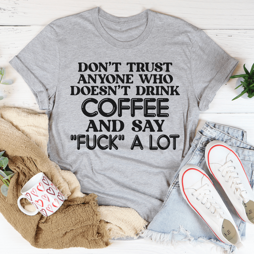 Gray T-shirt with bold coffee quote graphic, 'FUCK' a lot