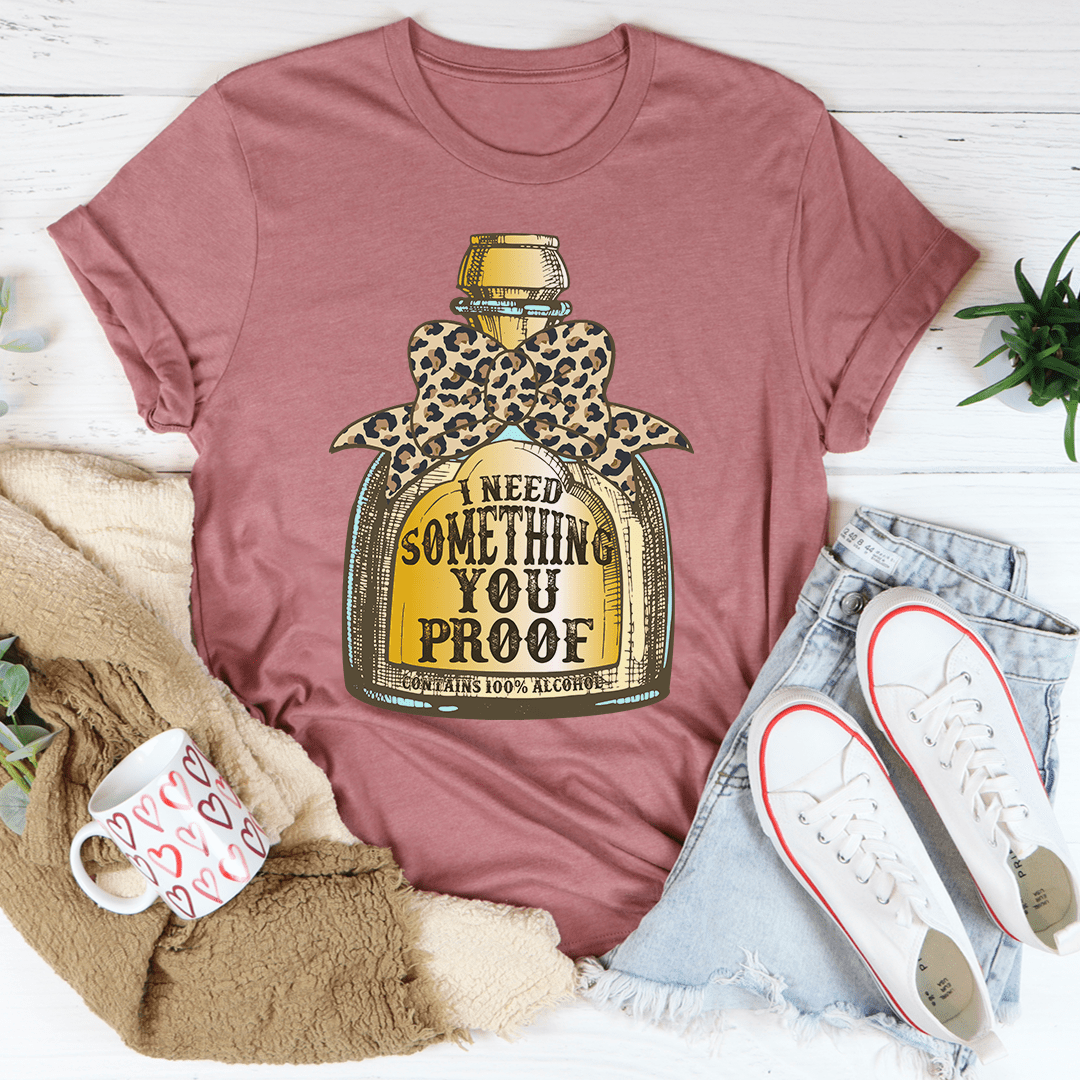 Mauve graphic T-shirt with leopard bottle print and 'proof' text