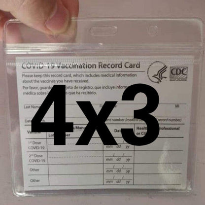 Clear plastic vaccination record card holder held in hand, “4x3” over the form