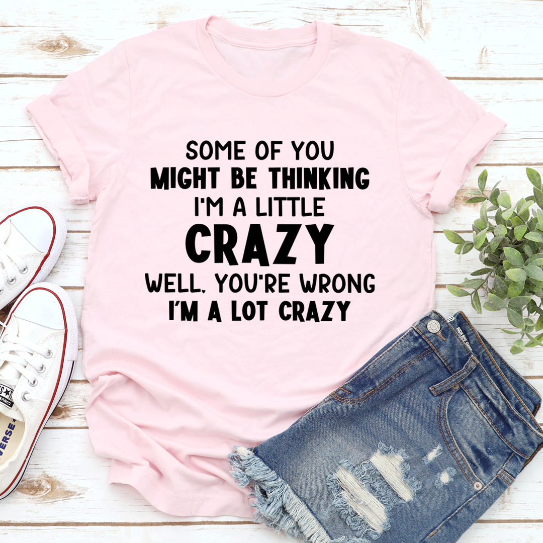 Light pink T-shirt with bold black 'I'm a little crazy' slogan print
