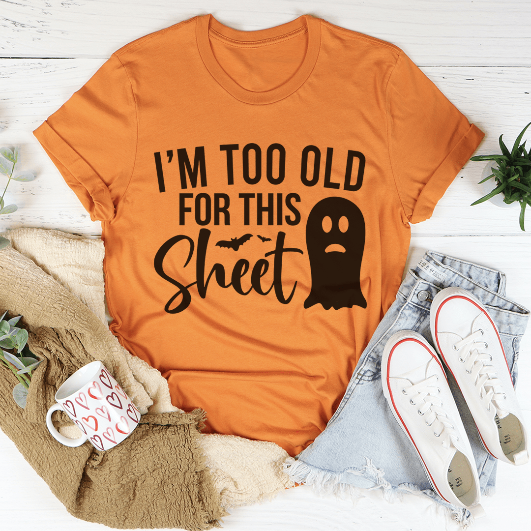 Burnt orange T-shirt with centered ghost graphic and slogan front print