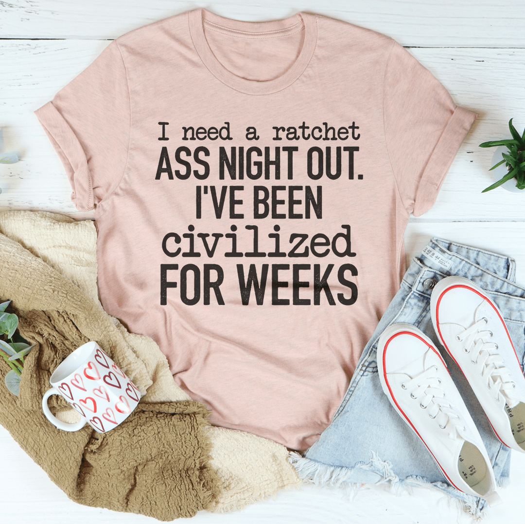 Mauve/pink crewneck T-shirt with bold black quote graphic: “ASS NIGHT OUT. I'VE BEEN CIVILIZED.”