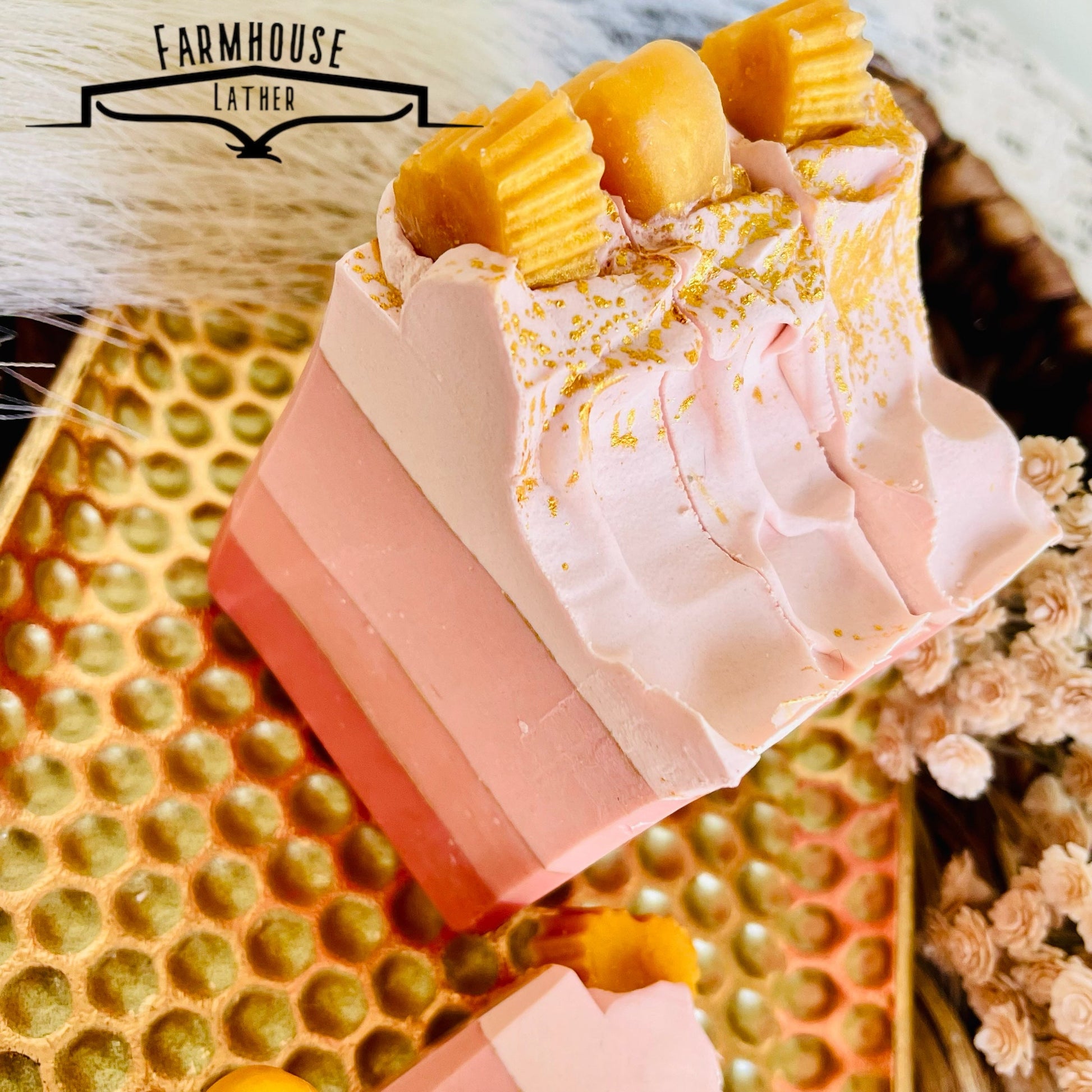 Layered pink soap bar with white ruffled top and yellow accent cubes
