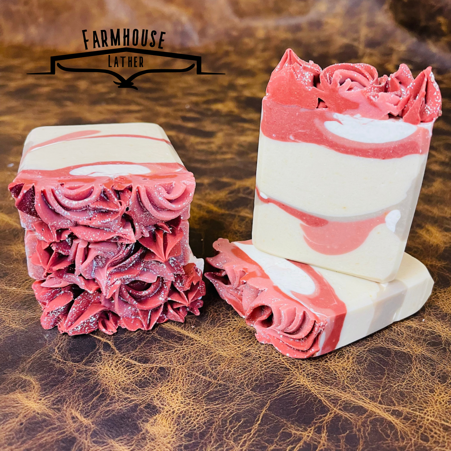 Set of layered soap bars with pink and white stripes and swirled sides