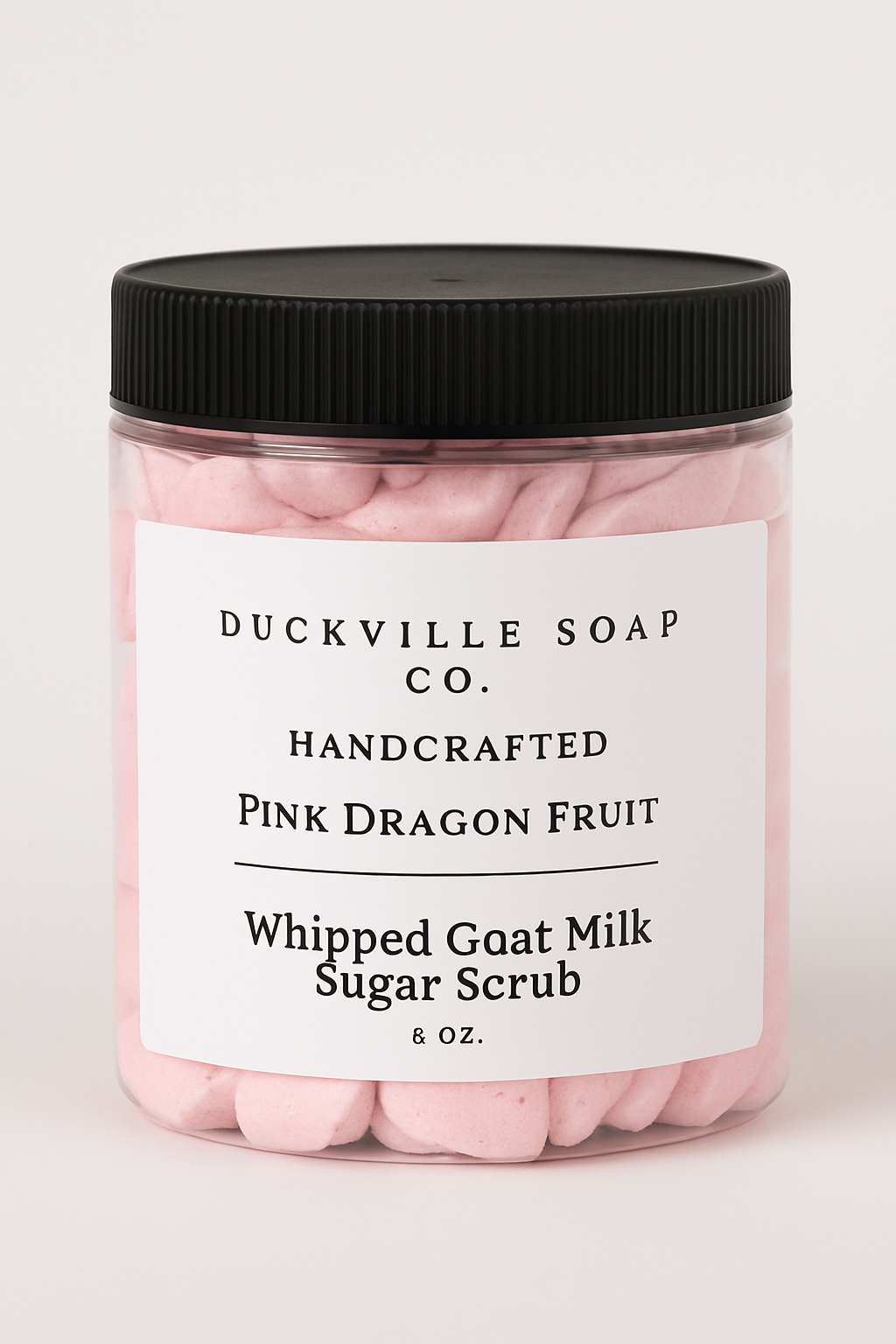 Whipped goat milk sugar scrub jar, Pink Dragon Fruit label, black lid, pink flakes